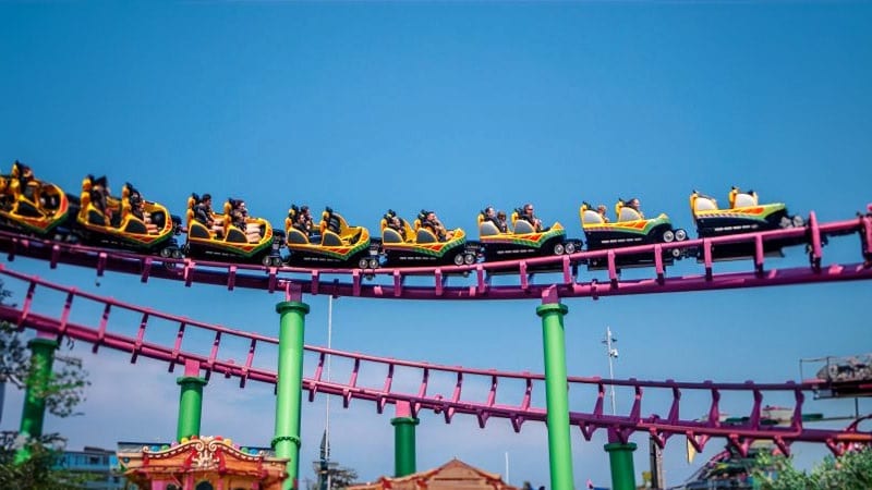 People enjoying a roller coaster ride at Fantasy Island, one of the popular attractions outside our caravan for rent Skegness. Experience thrills and excitement just moments away from your caravan getaway