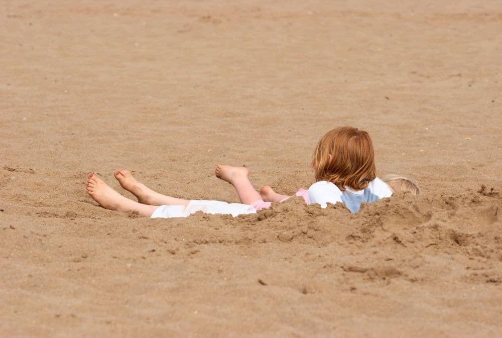 Children enjoying family time on the beach during a static caravan holiday