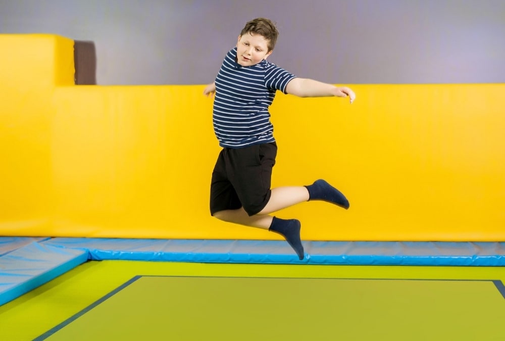 Child jumping at an indoor trampoline park near Skegness