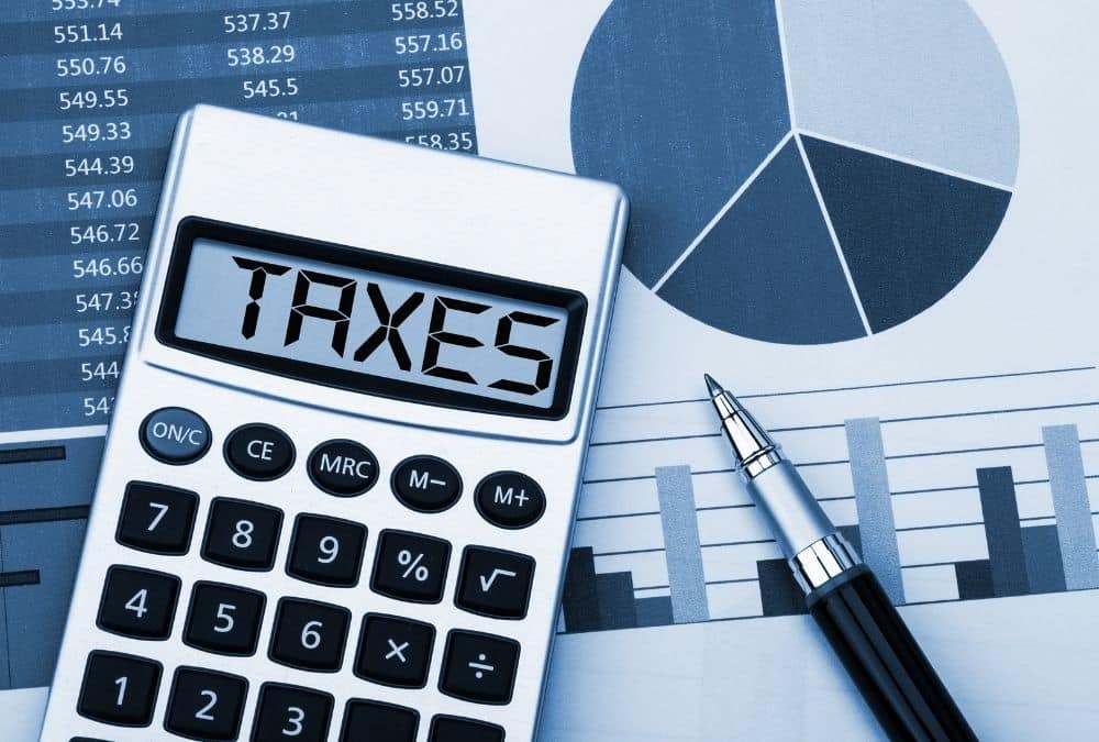 Calculator and financial documents used to calculate static caravan tax and business rates