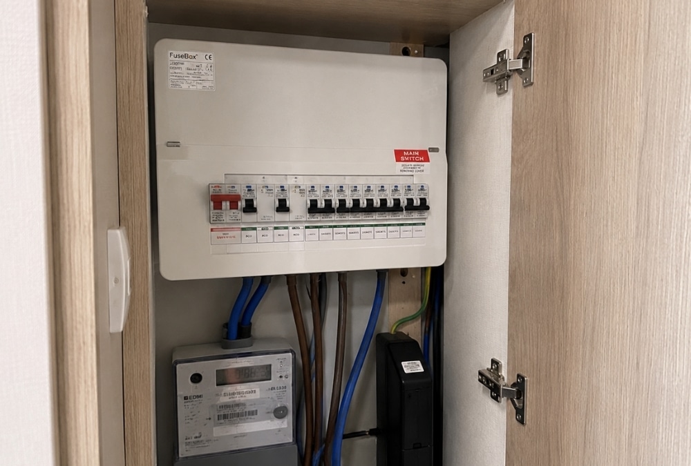 Consumer unit inside a static caravan storage cupboard ready for an electrical safety inspection.