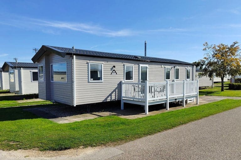 caravans for sale UK The exterior of a Premium Pet-Friendly 3 Bedroom Caravan featuring stylish steps and decking, offering a welcoming entrance.
