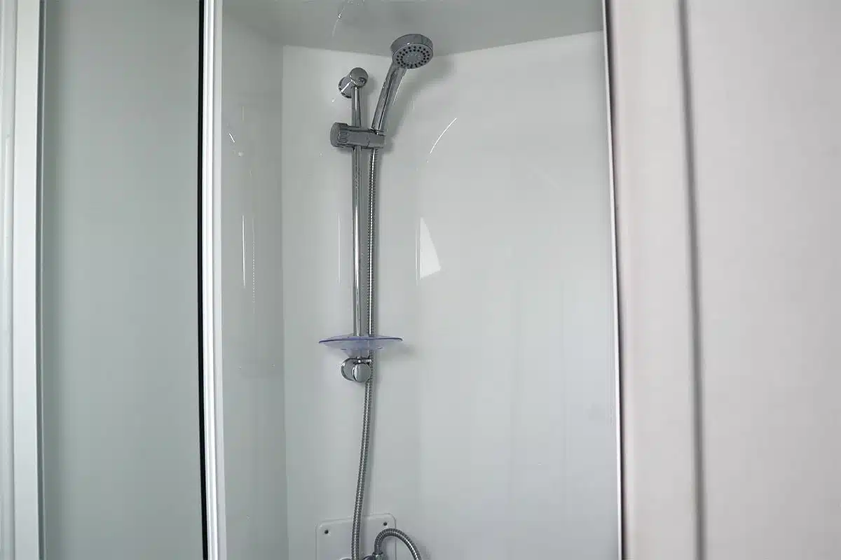 Close-up of the shower in a Standard 3 Bedroom Caravan, featuring a modern design for a relaxing experience.