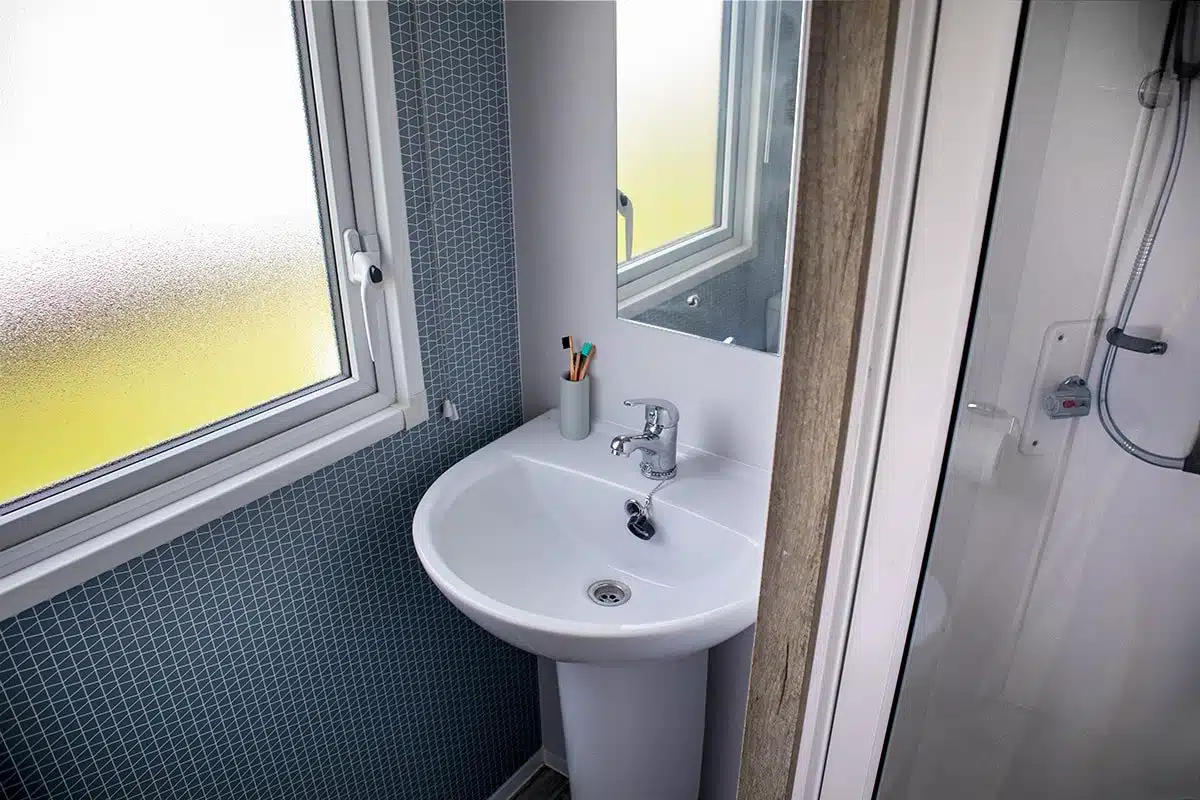 Bathroom in a Standard 3 Bedroom Caravan, designed for convenience and comfort during your stay.