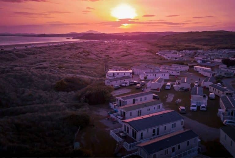 Holiday caravans overlooking coastal dunes at sunset on the Lincolnshire coast