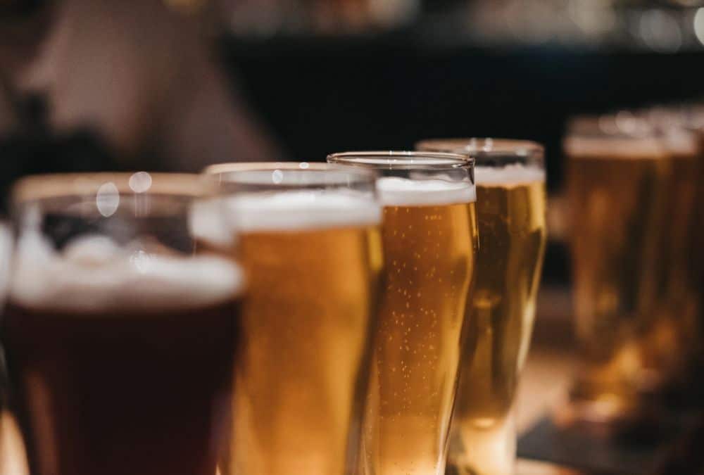 Pints lined up at Wellies Bar showing the lively atmosphere of Skegness clubs