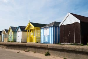 Colourful beach huts along the sea wall at Chapel St Leonards on the Lincolnshire coast