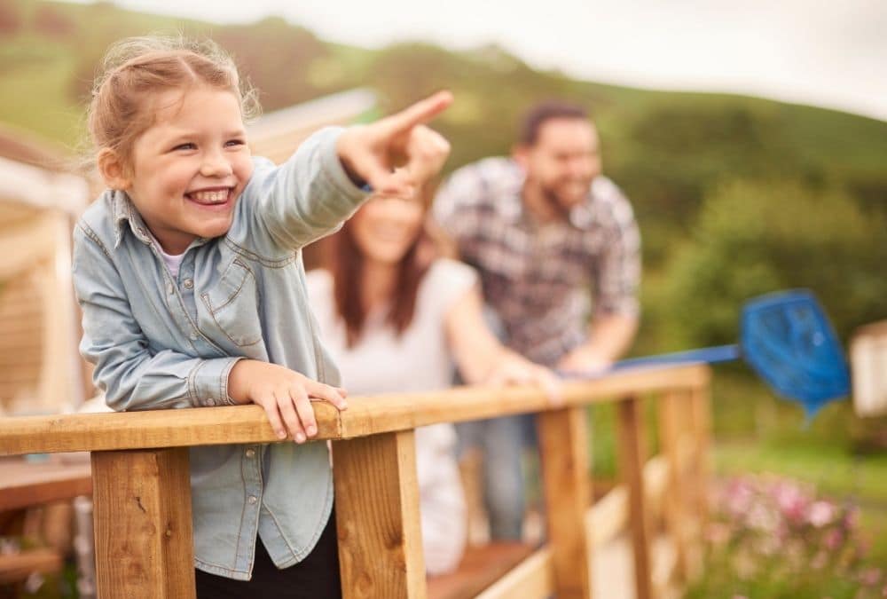 Family enjoying time outside their static caravan holiday home